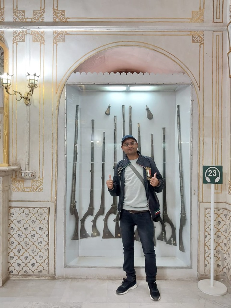 Harry in the palace museum explaining historic swords and heritage