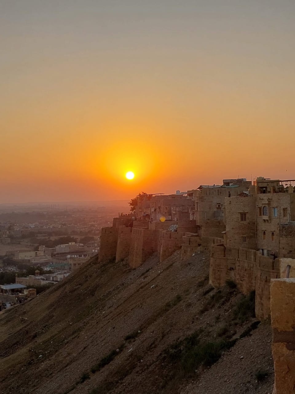 Cinematic golden sunset over Jaisalmer Fort and ramparts